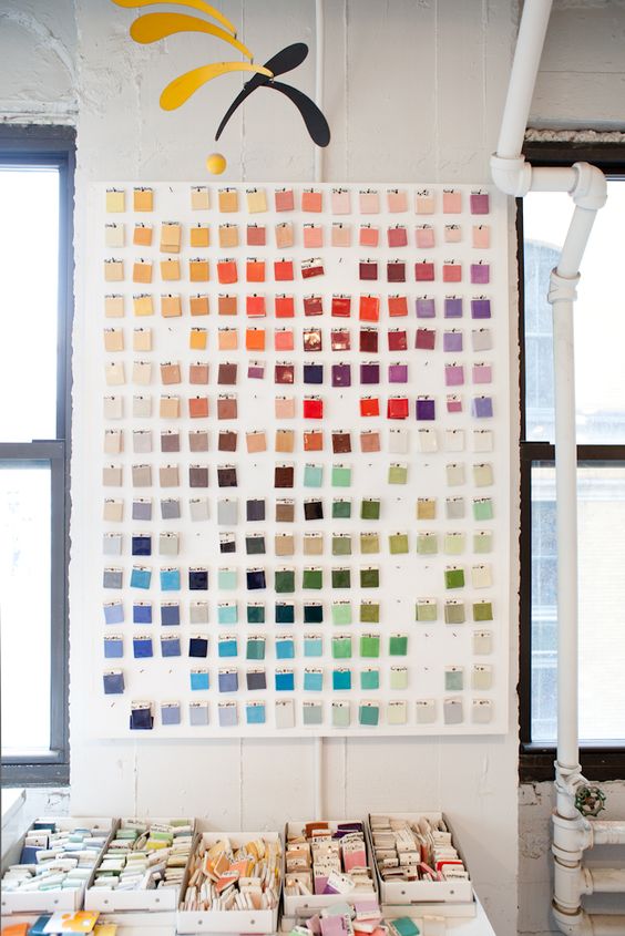 ceramic swatch color charts hanging on a wall